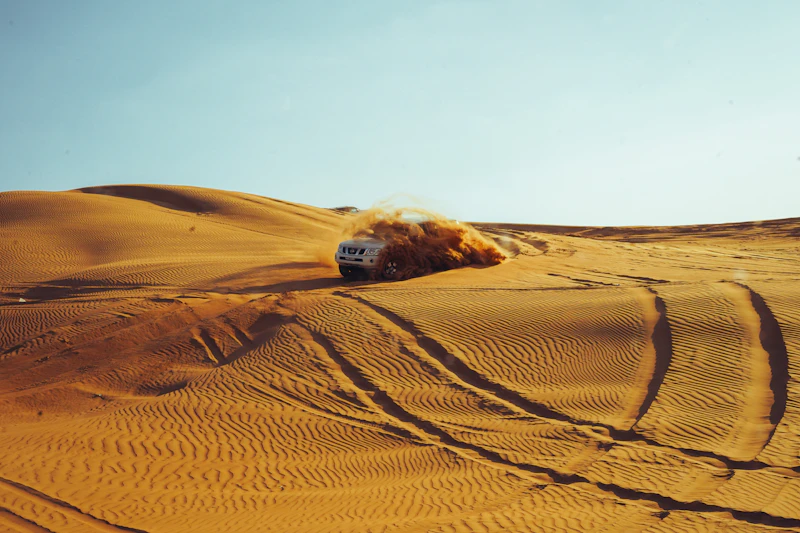 4x4 kicking up sand on a Dubai desert safari