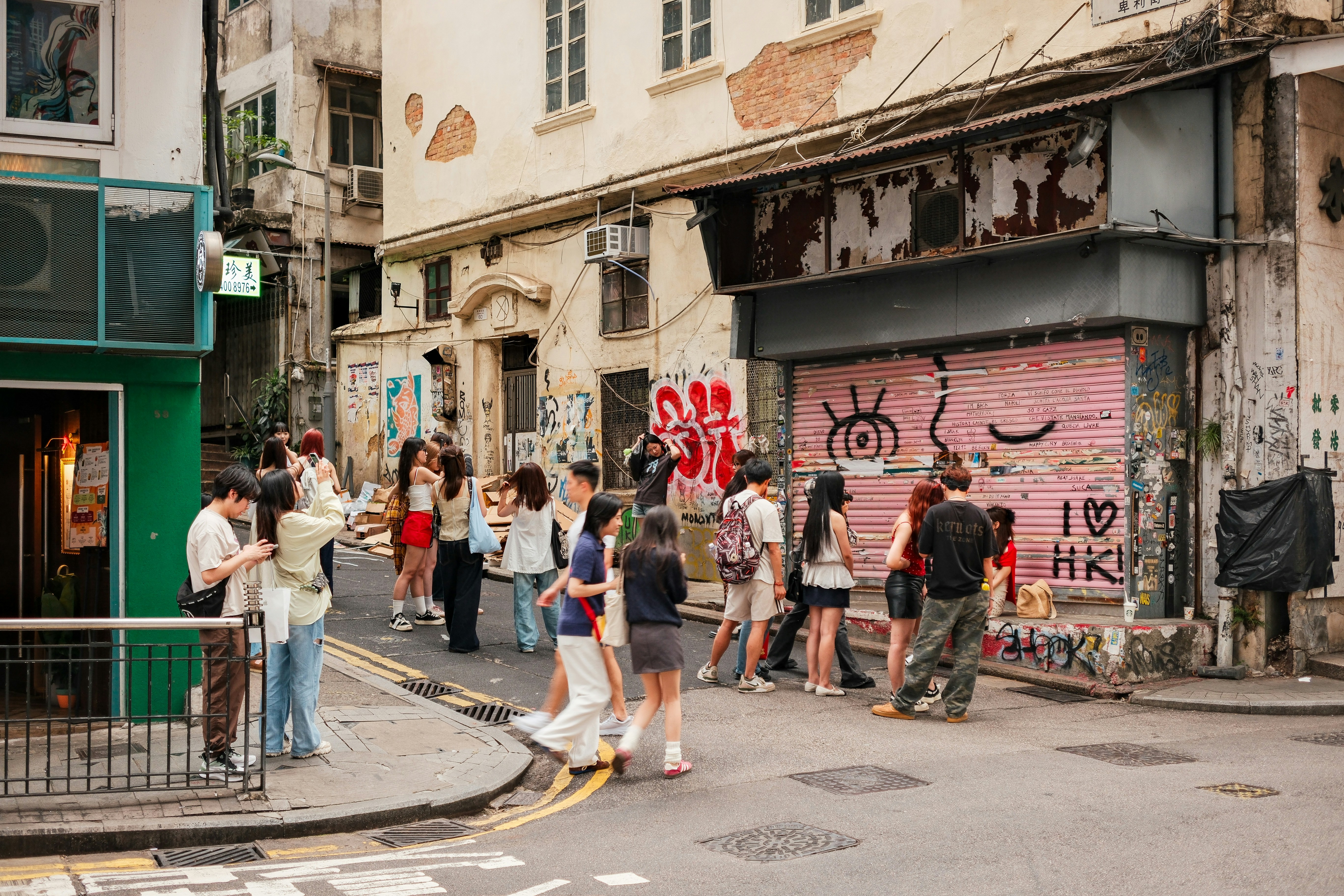 People gather and explore an urban street.
