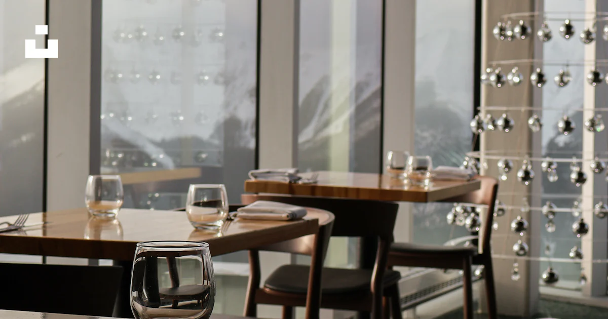 Restaurant tables by large windows with a view. photo – Free Food Image ...
