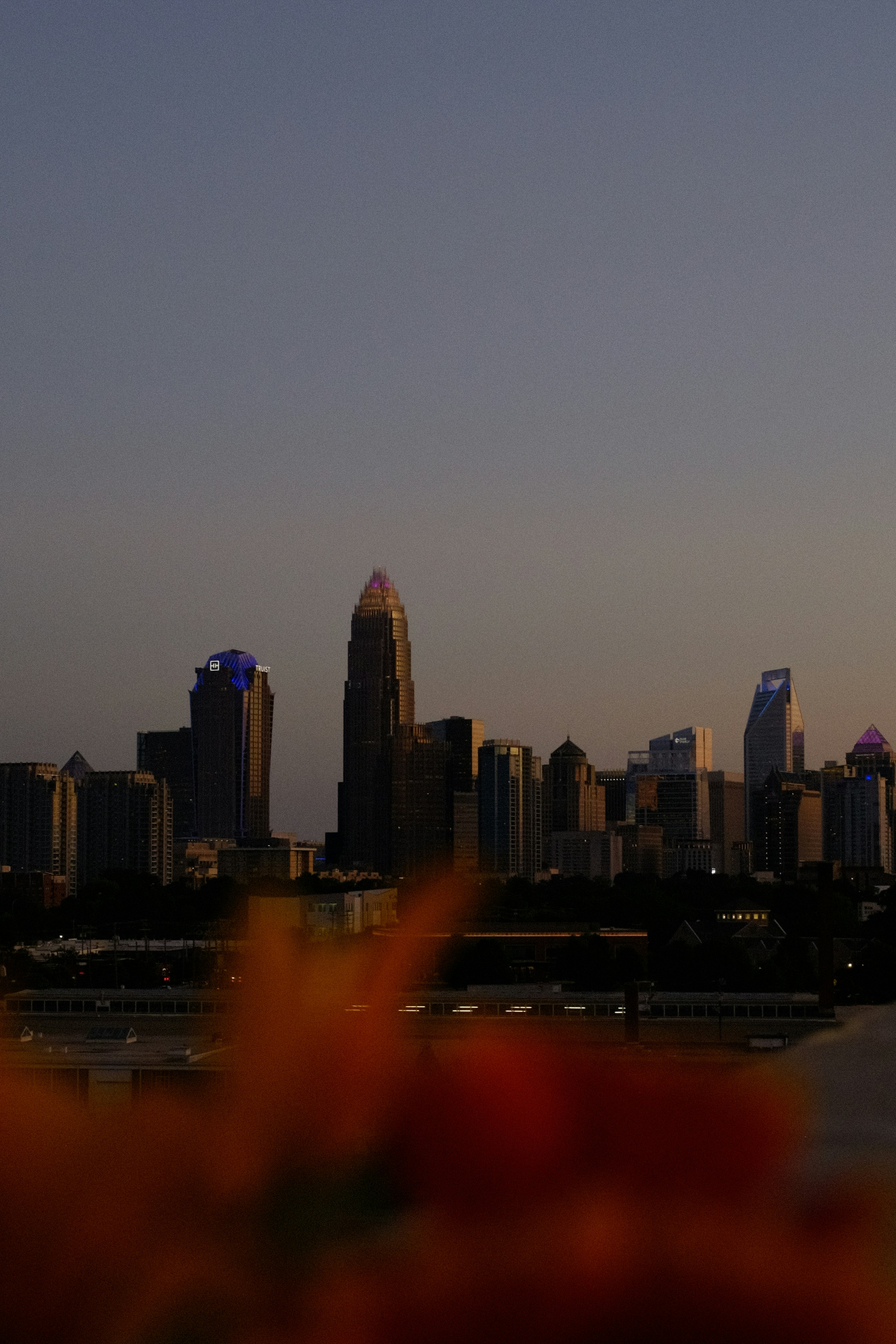 City skyline silhouetted against a dusky sky.