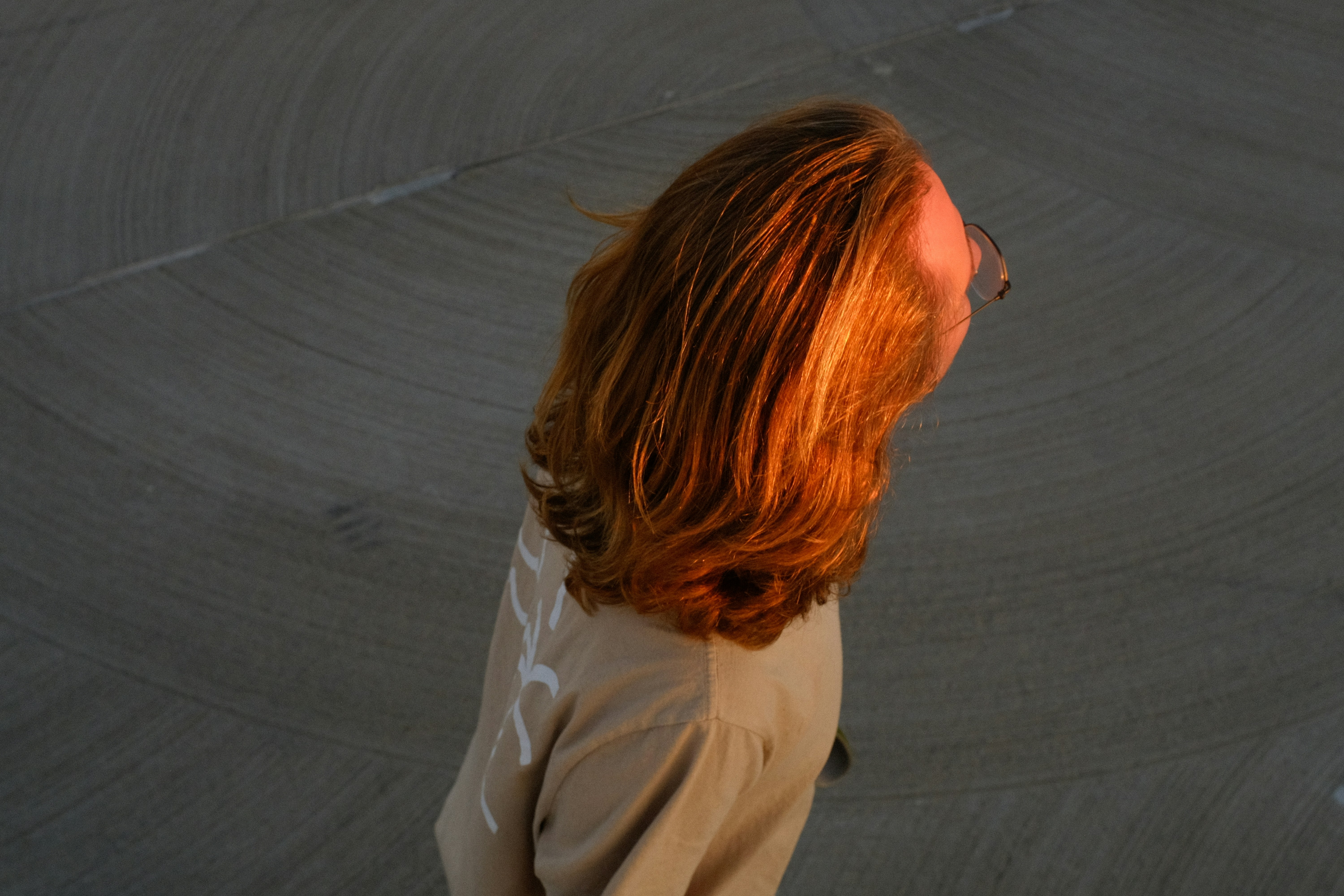 person with healthy hair and glowing skin - biotin infusion benefits