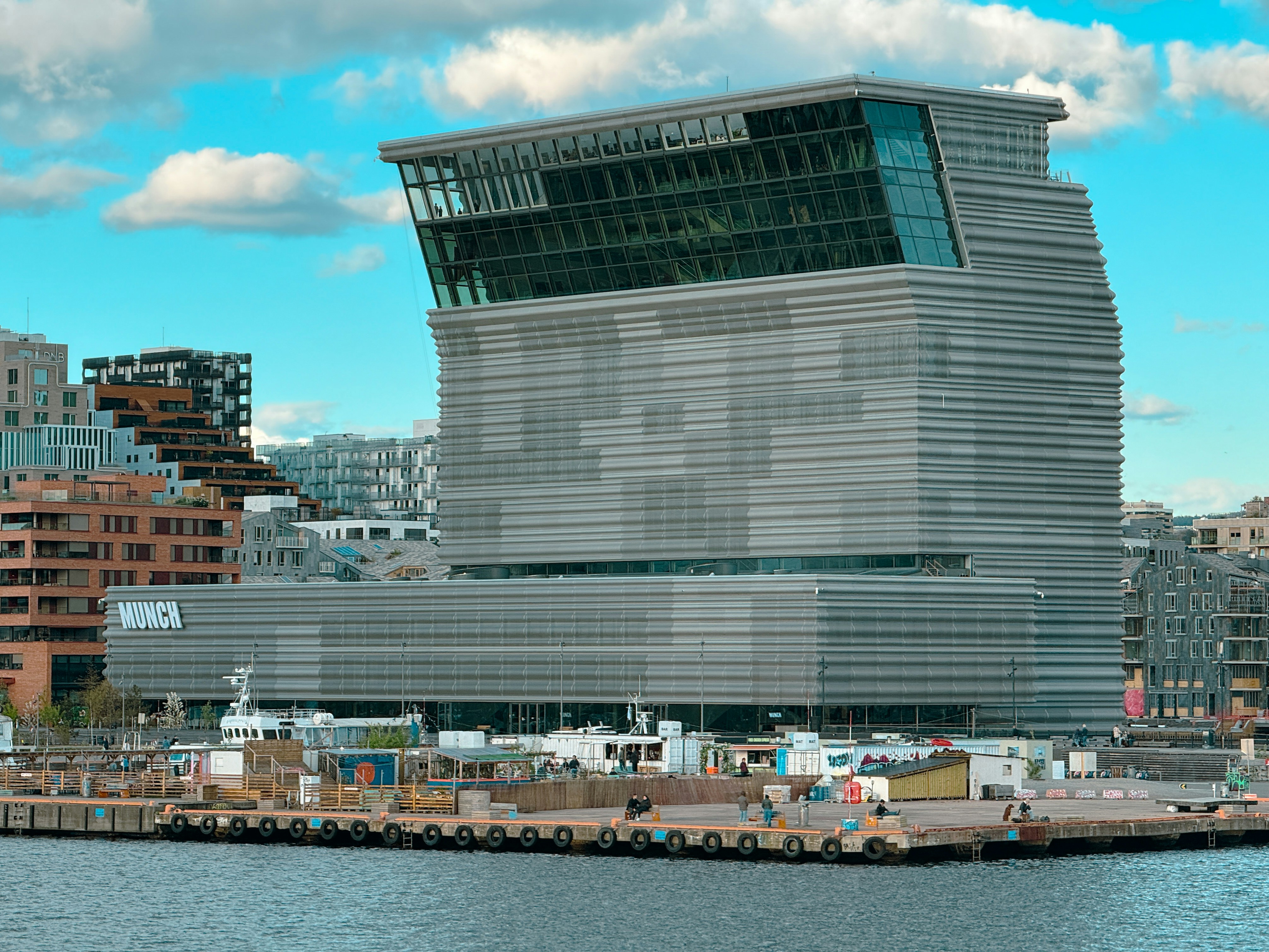 A modern building stands near the waterfront.