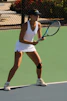 A tennis player prepares to hit the ball.