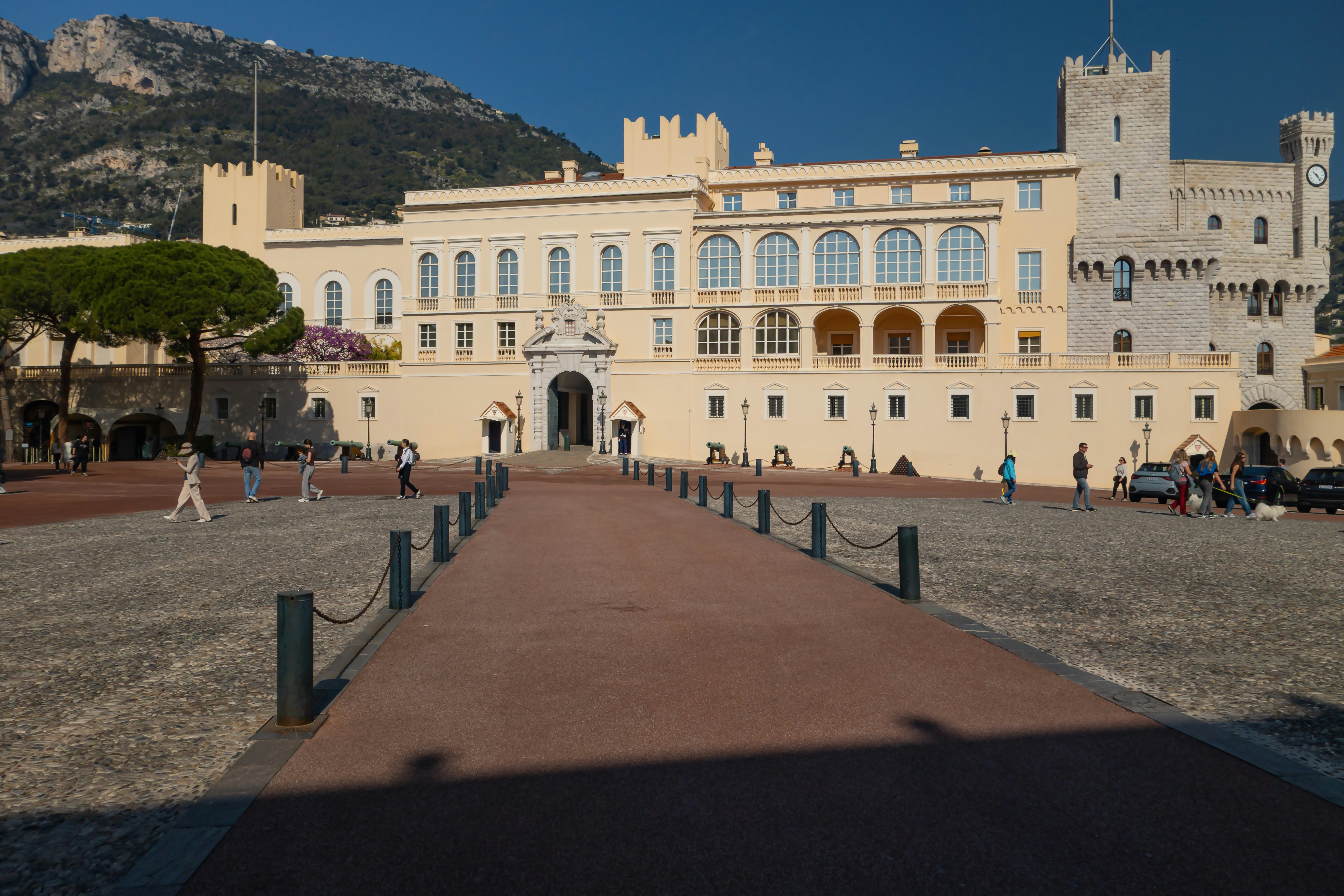 The palace of monaco stands grandly under the sun.