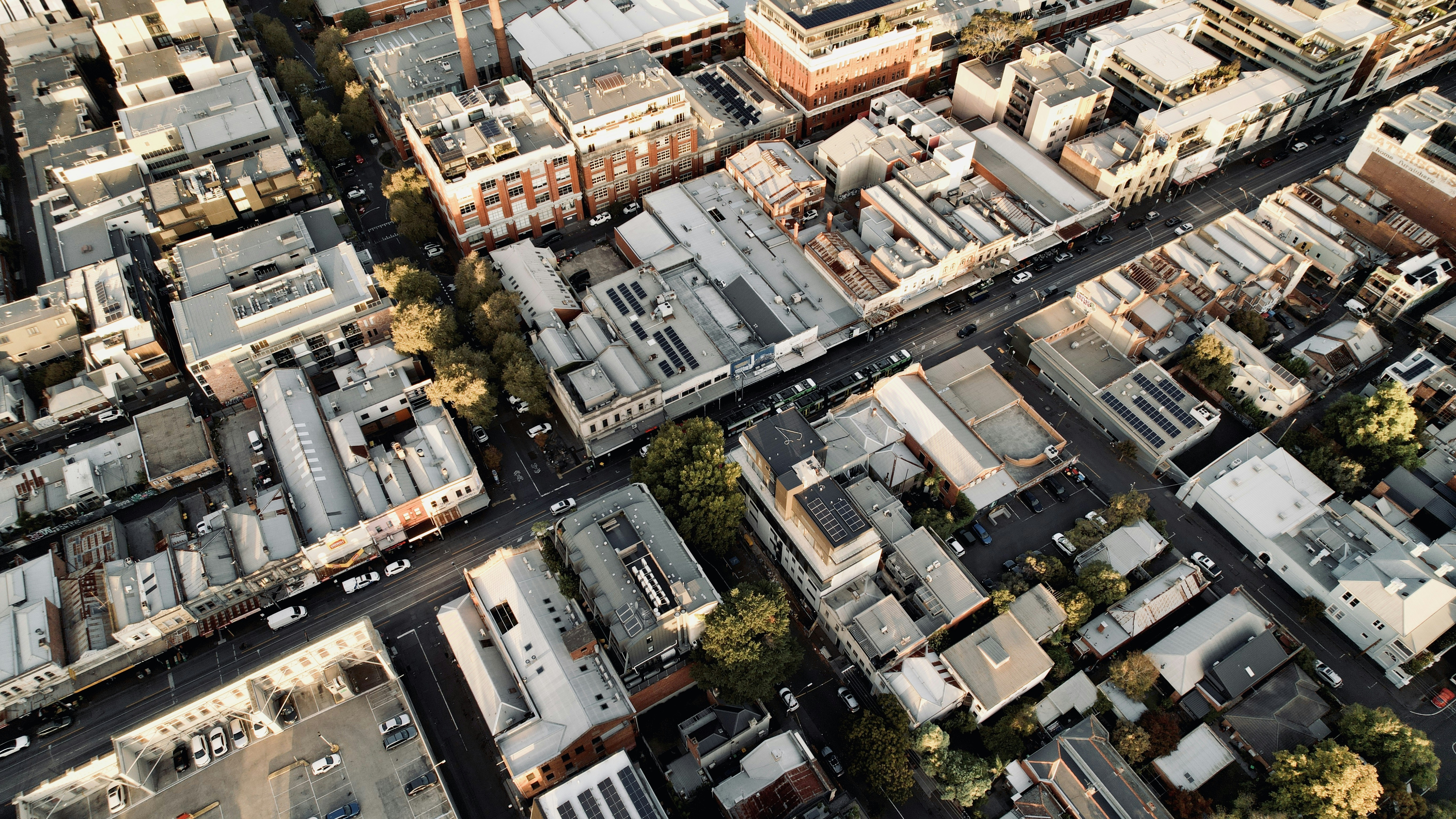Aerial view of a city street with buildings.