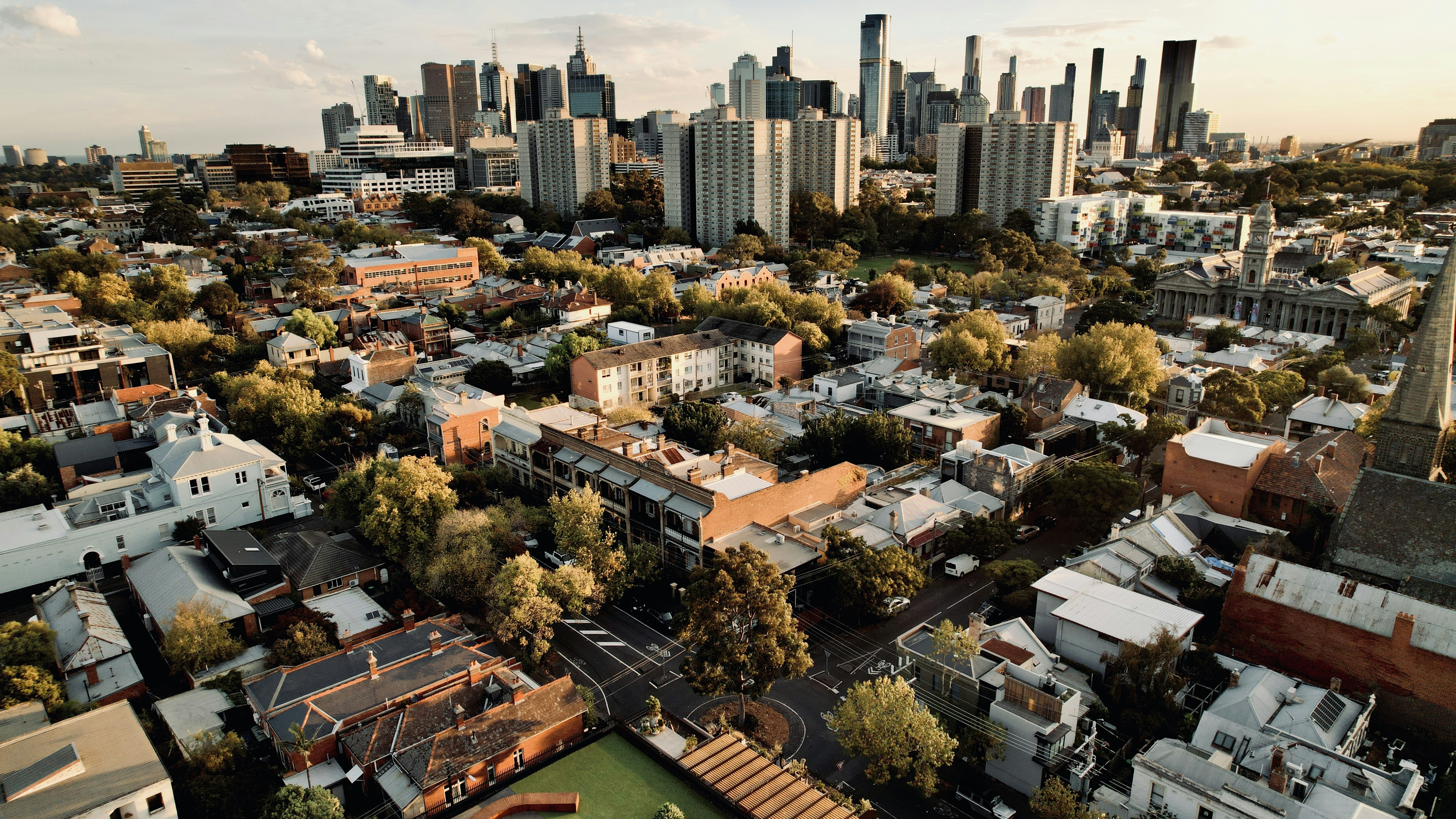Aerial view of a cityscape with tall buildings., 