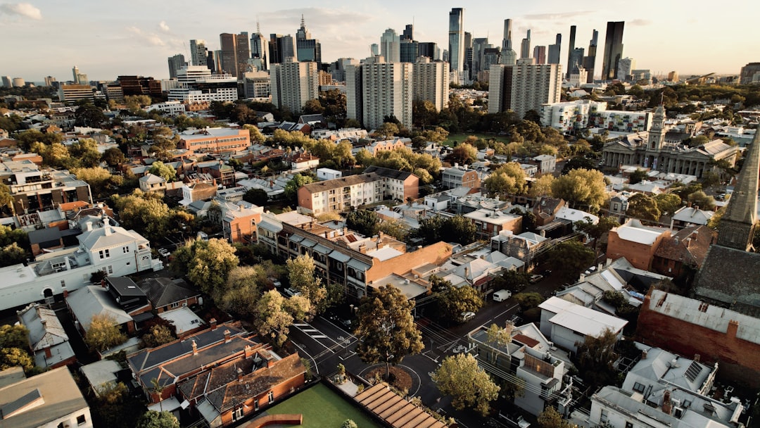 Aerial view of a cityscape with tall buildings.,