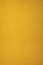 A plain, textured background of golden yellow.