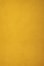 A plain, textured background of golden yellow.