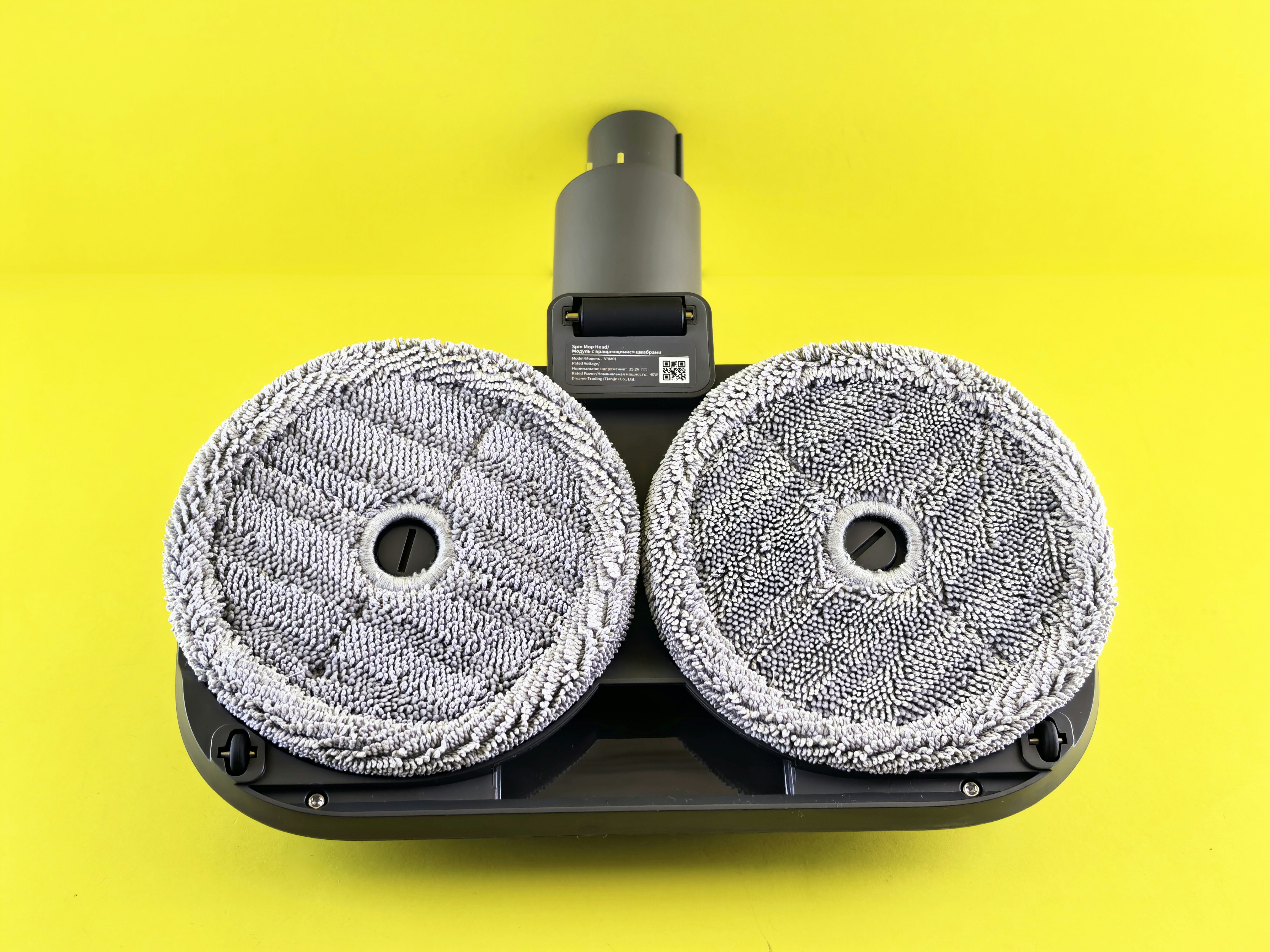 robotic vacuum cleaner rotating mop pads close up