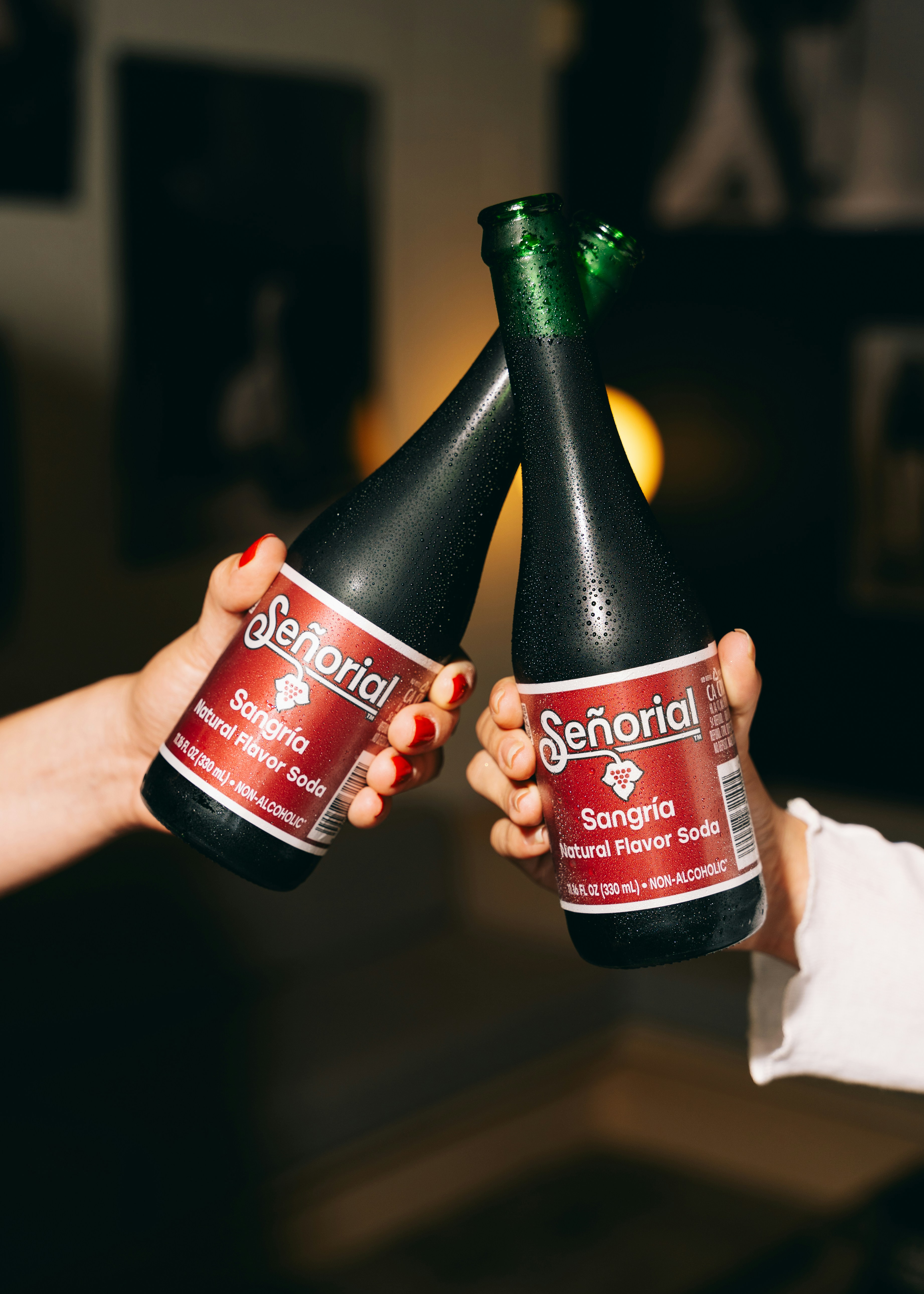 People are toasting with sangria sodas.