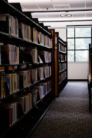 Rows of books line the shelves in the library.
