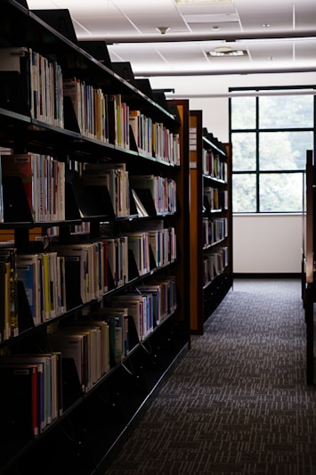 Rows of books line the shelves in the library.