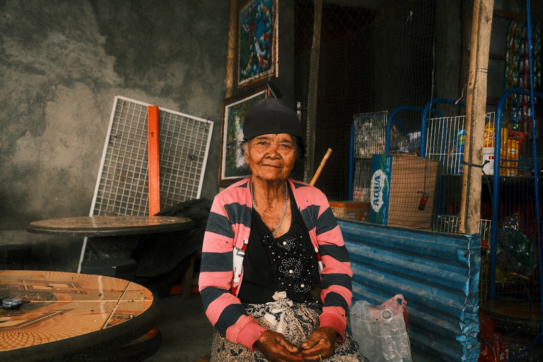 A smiling woman poses for a photo.,