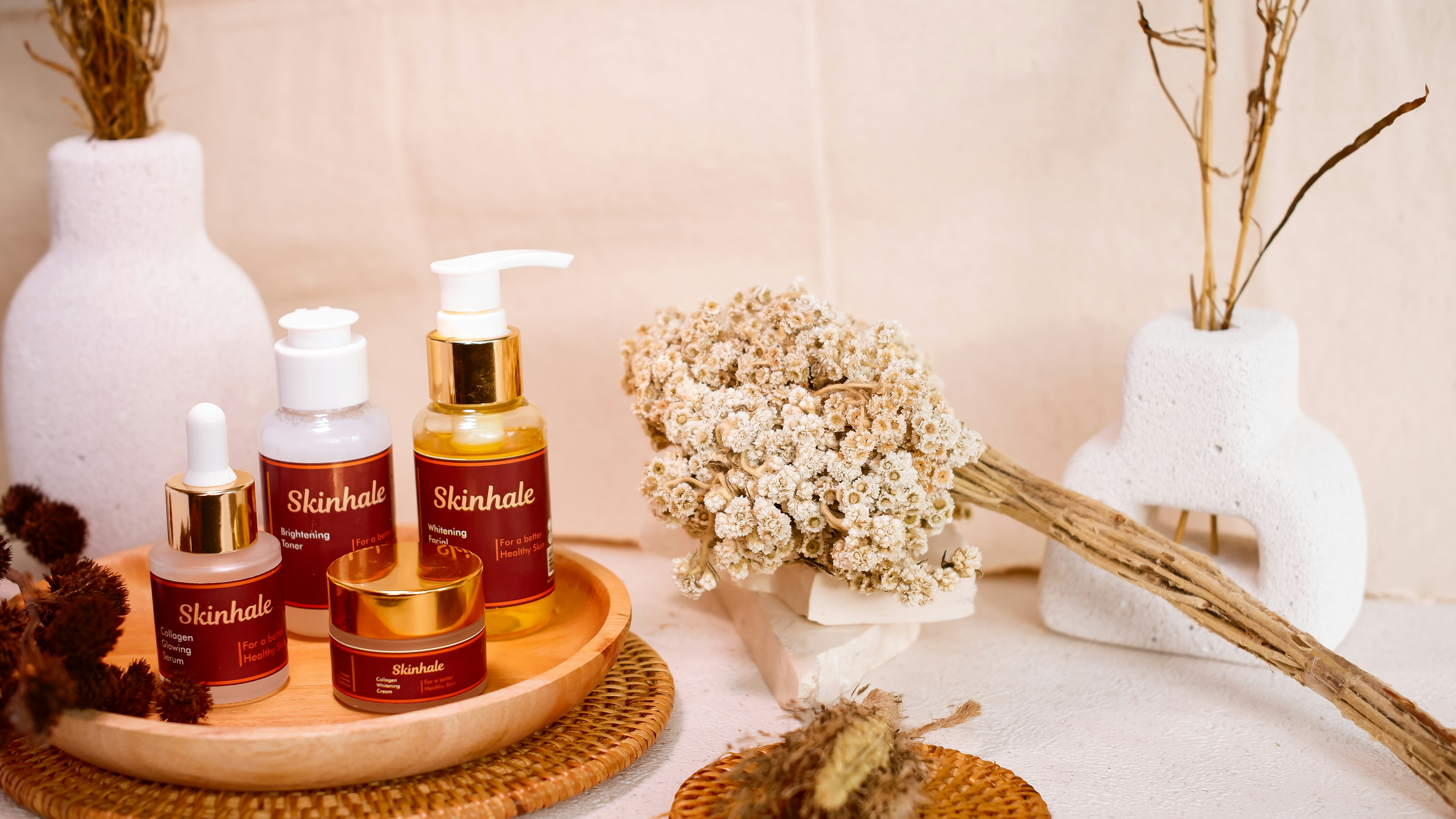 Skincare products are beautifully arranged for a display.