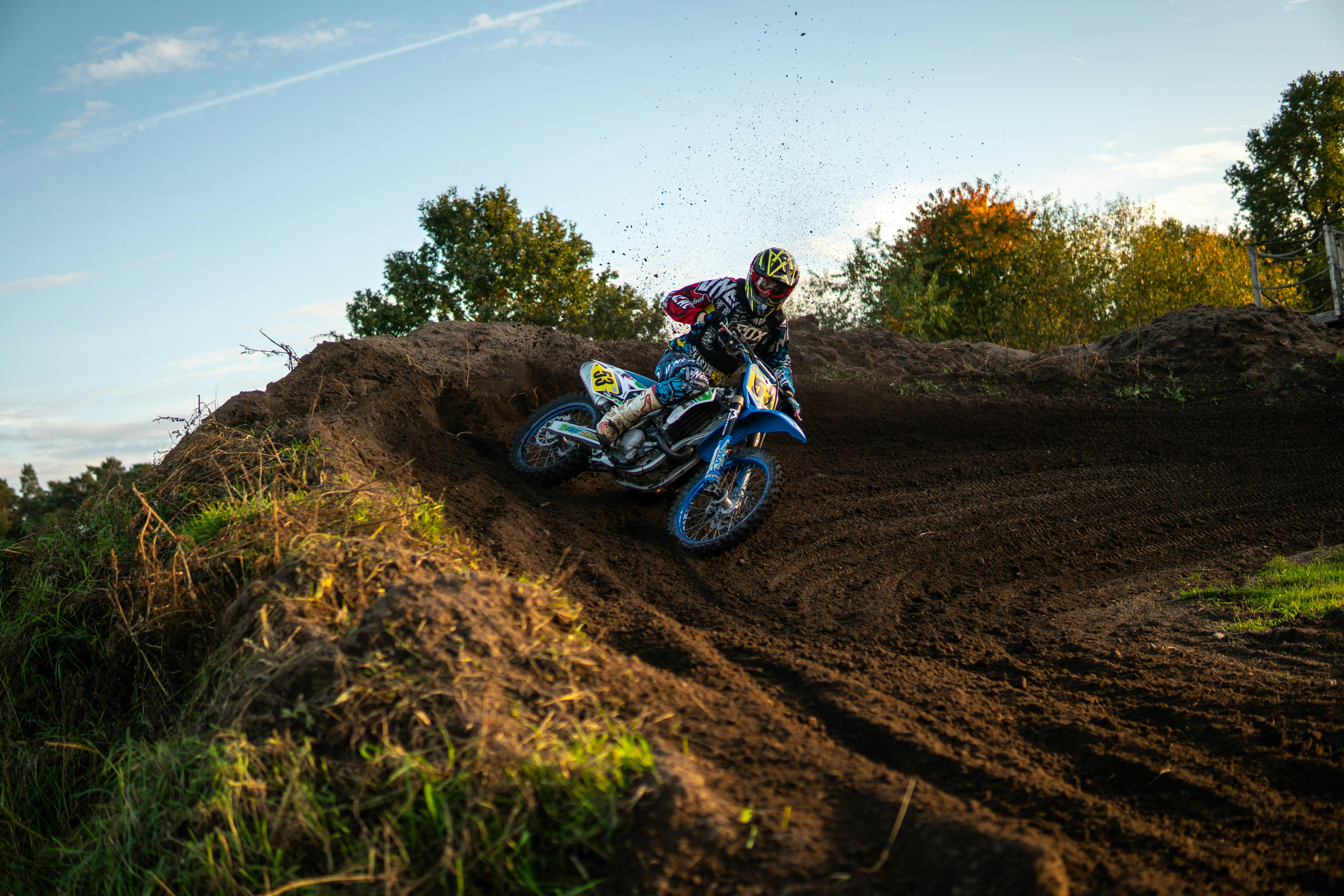 Motocross rider cornering on a dirt track
