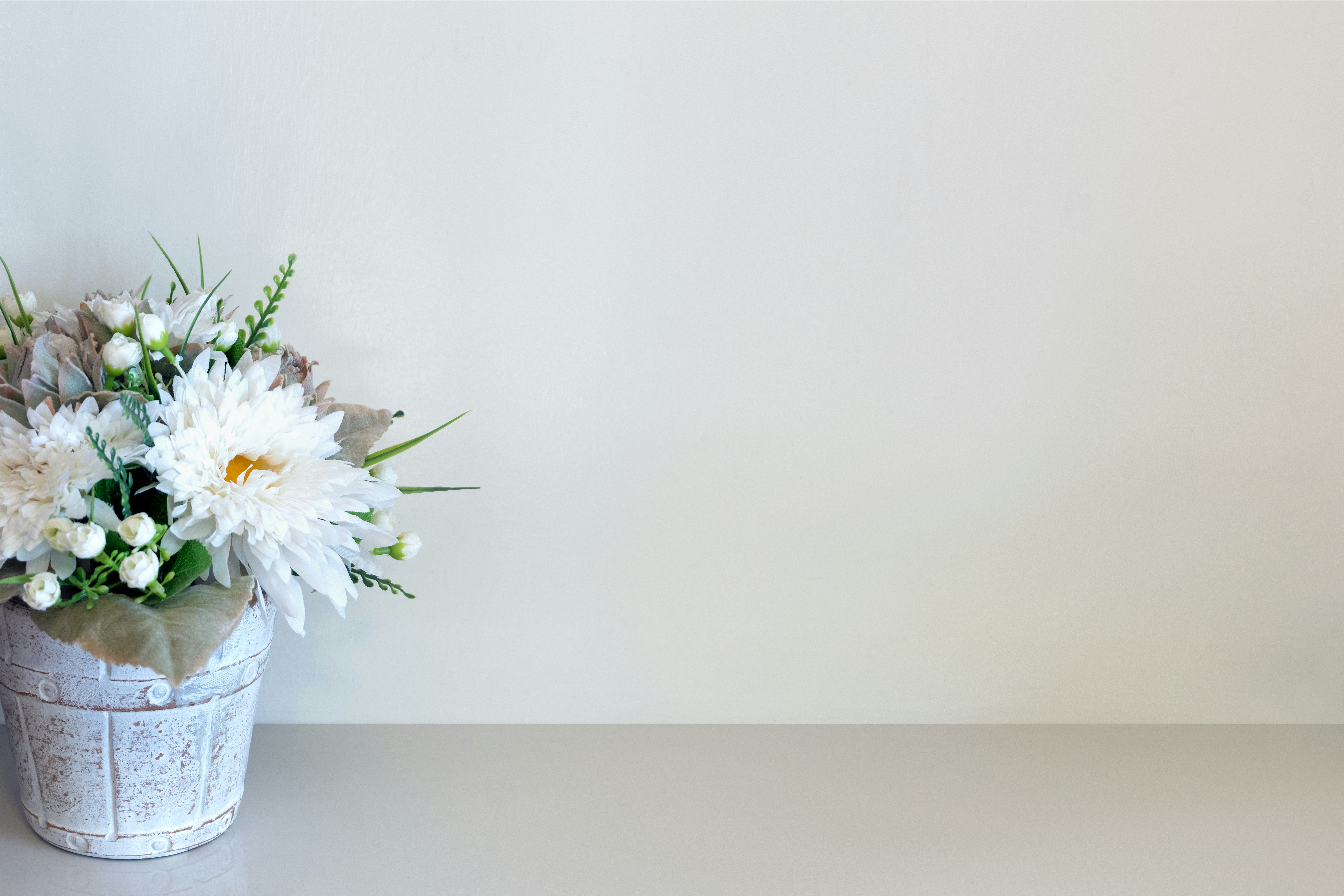 White pot with flowers