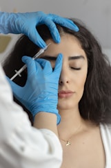Botox injection being administered to a woman.
