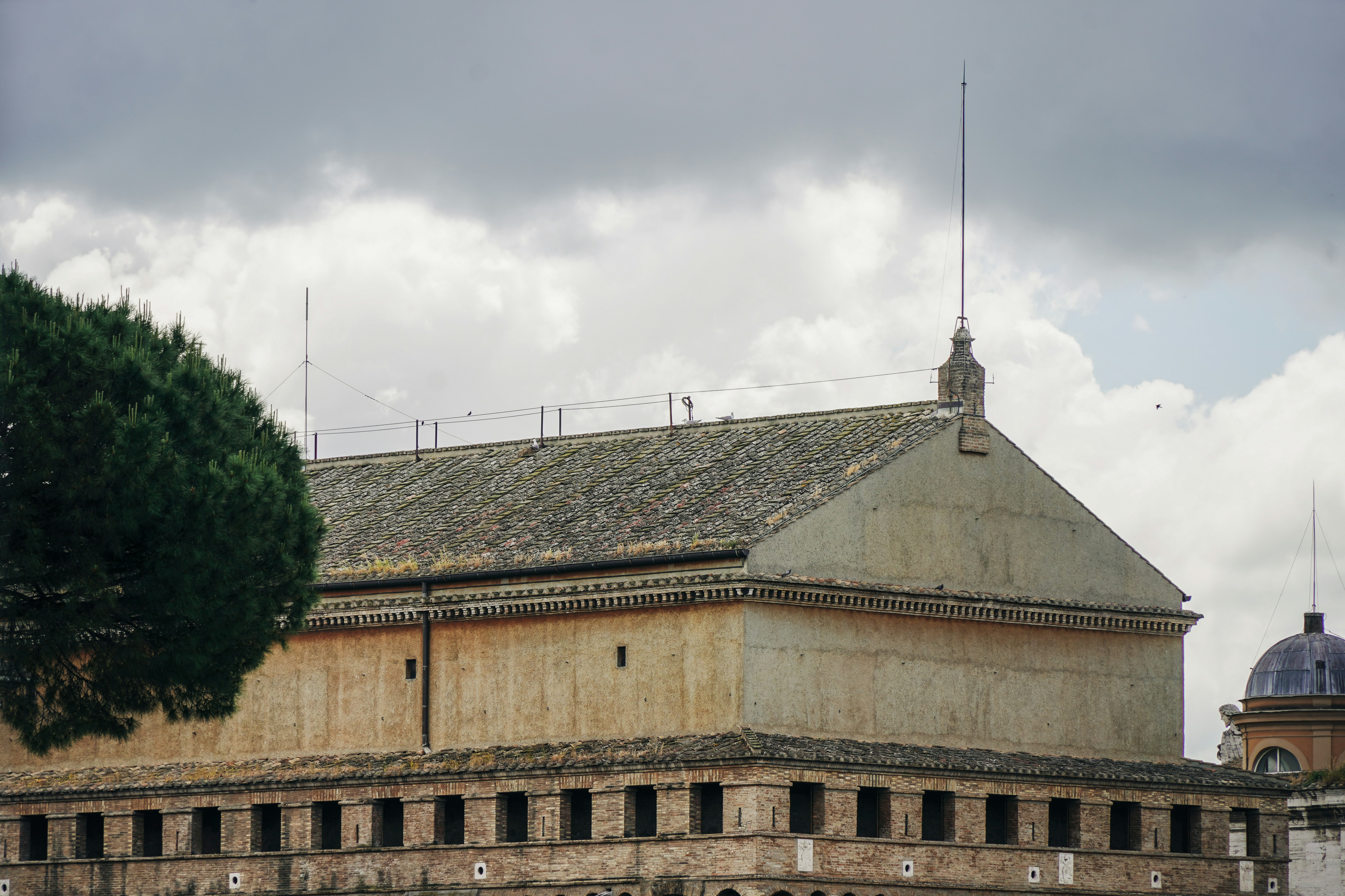 Building under a cloudy sky.