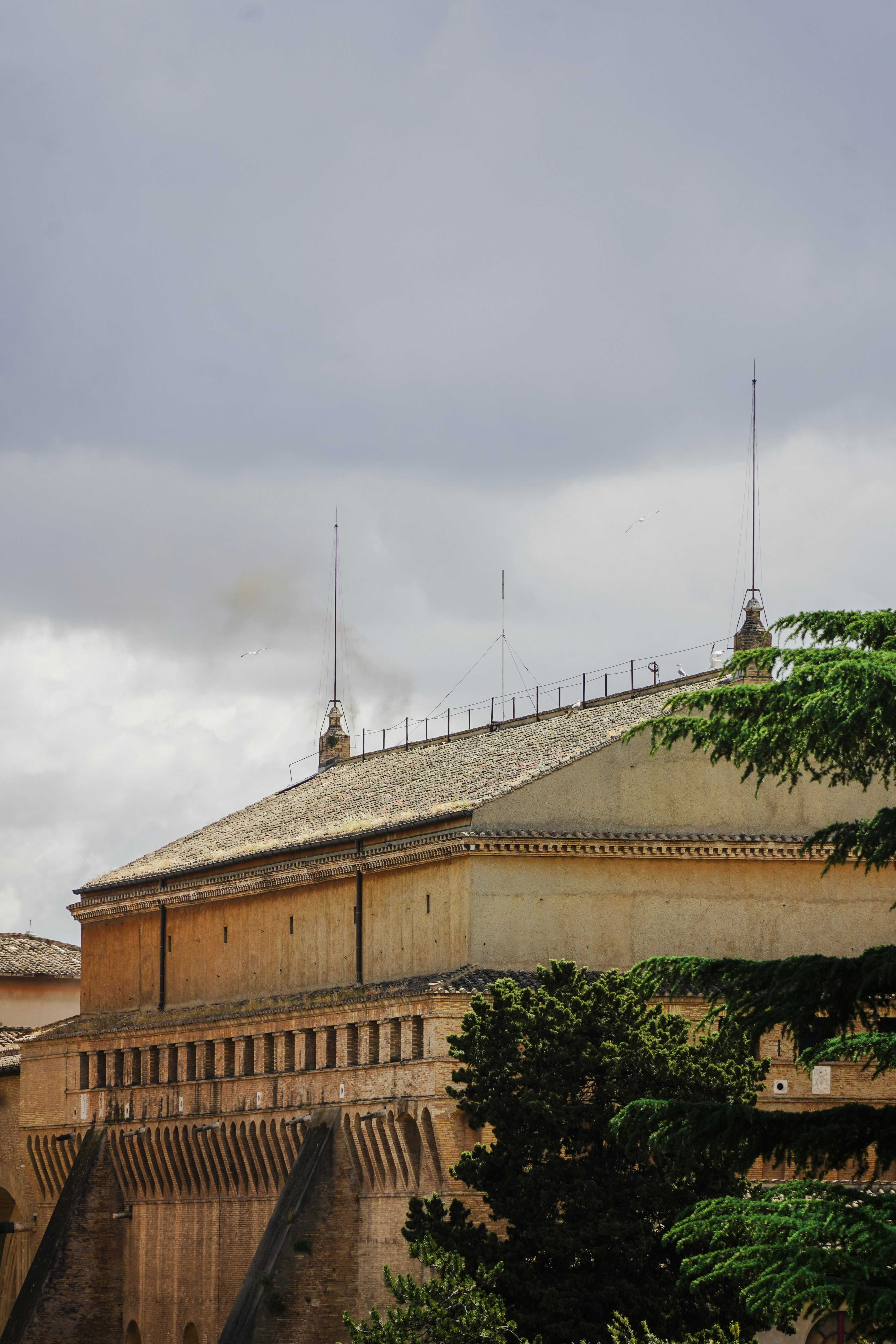 A church building stands beneath a cloudy sky.
