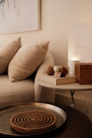Cozy living room with decorations and soft lighting.