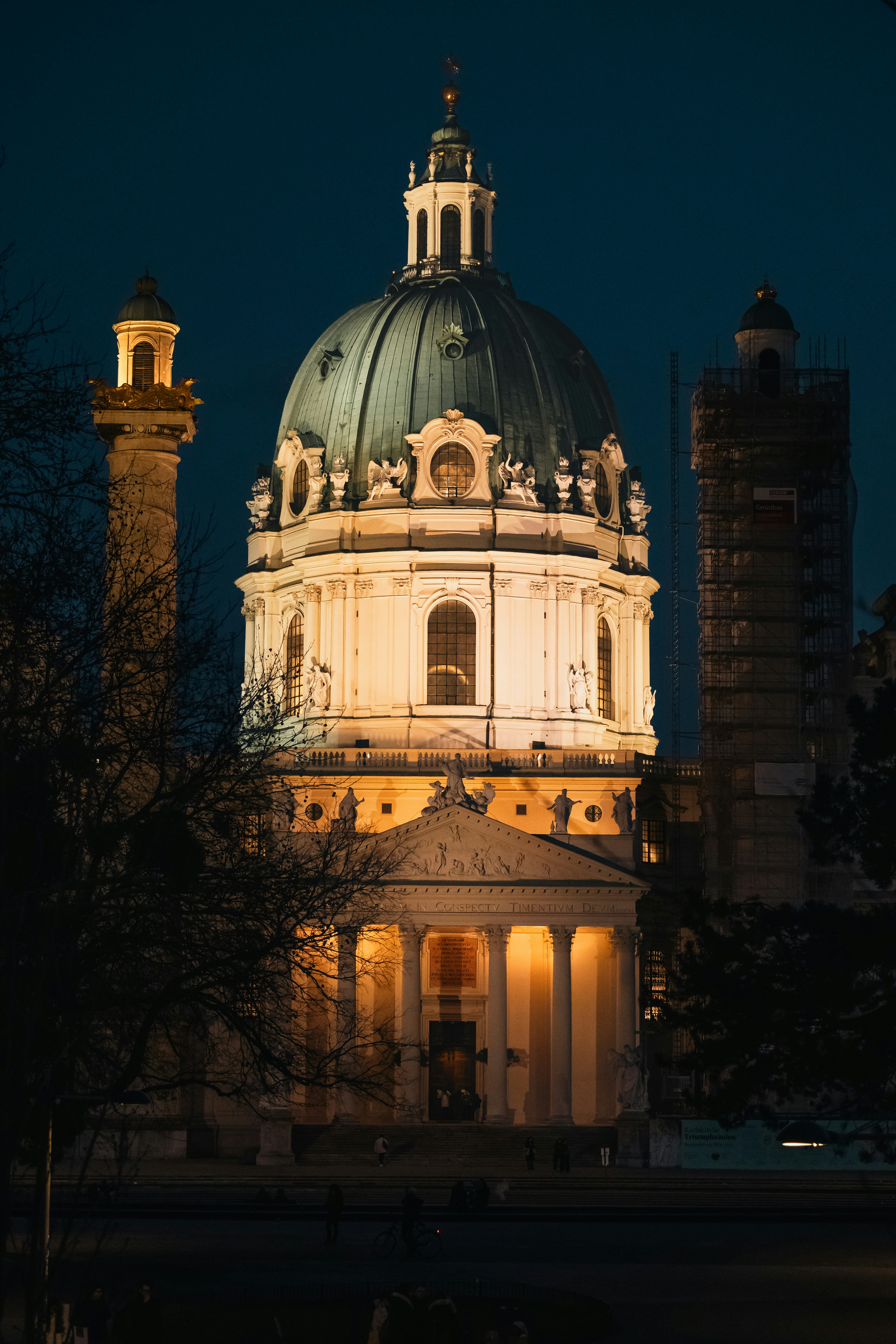 A beautiful illuminated building is seen at night.