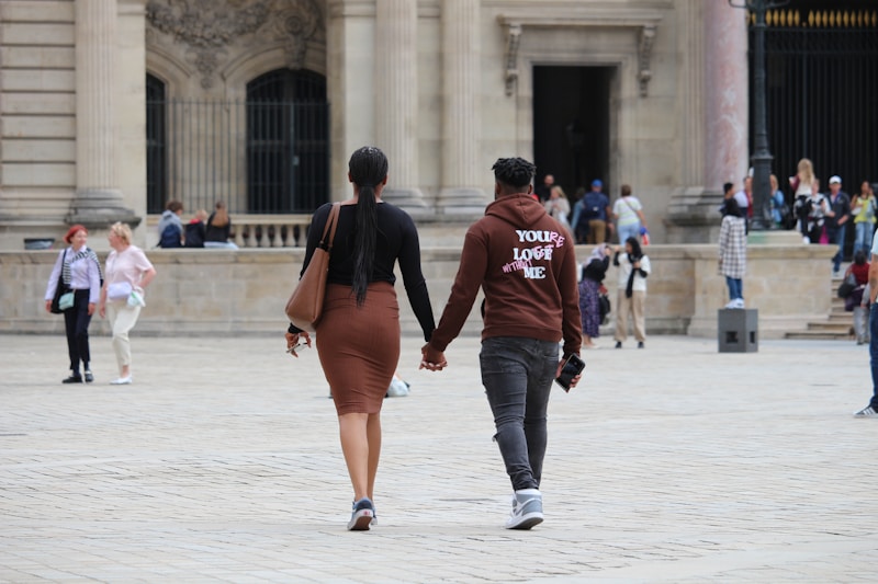 Couple holding hands abroad
