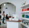 A hair salon interior with hair products and clients.