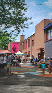People enjoying an outdoor event on a sunny day.