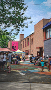 People enjoying an outdoor event on a sunny day.