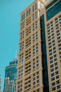 Tall skyscrapers against a bright, blue sky.