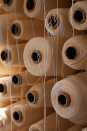 Spools of thread are stacked neatly together
