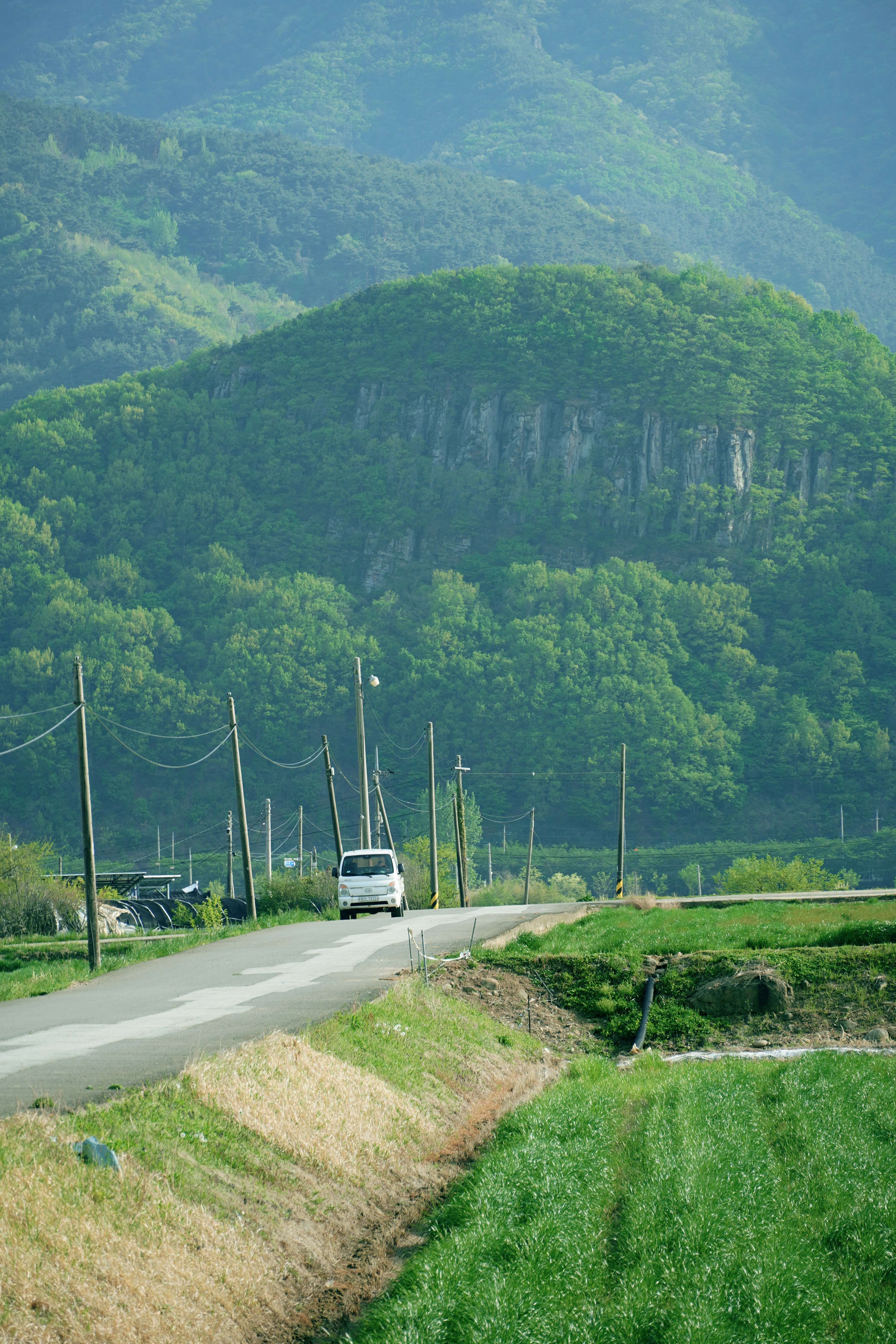 Car traveling a mountain road in Korea