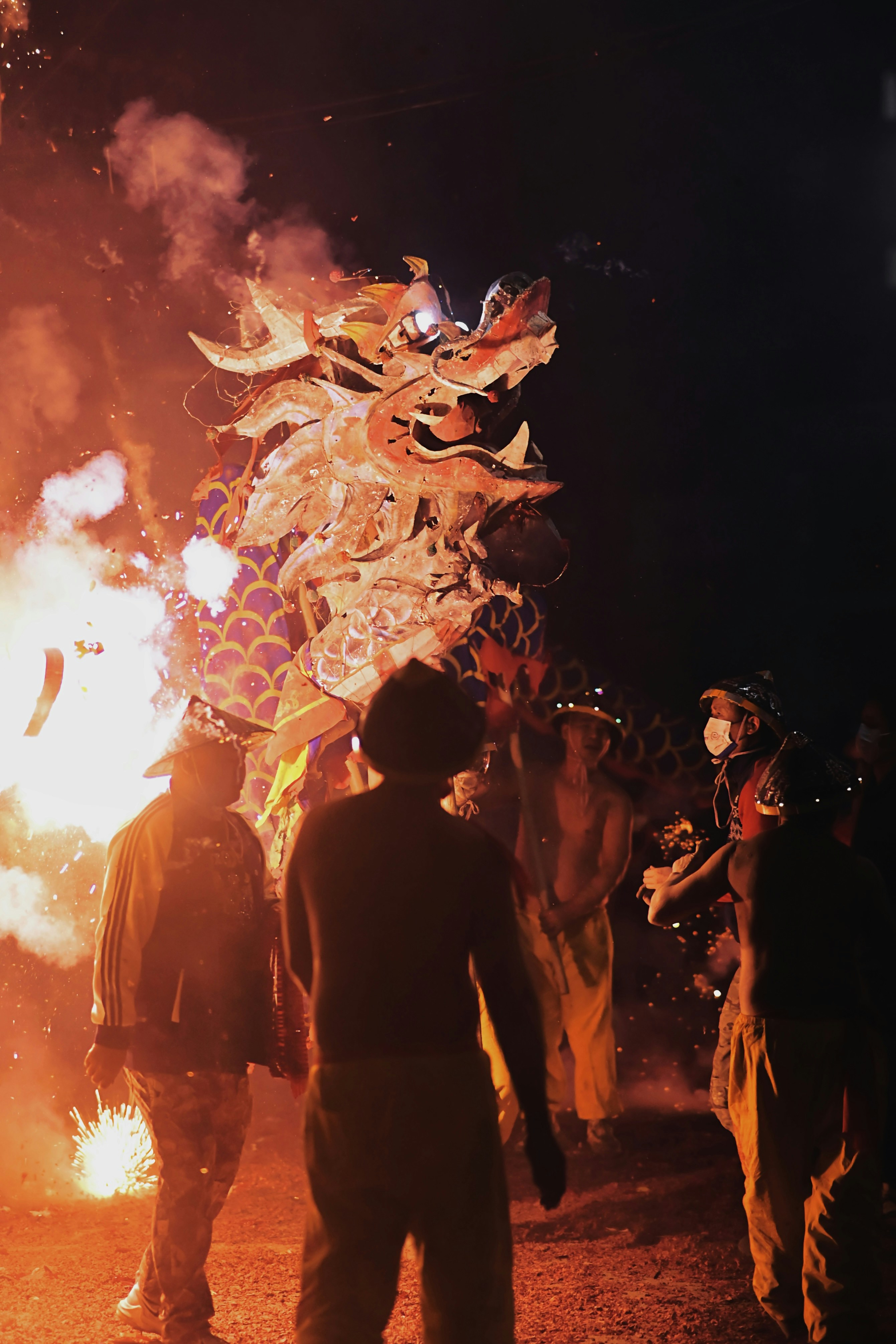 A dragon is paraded in the midst of fire.