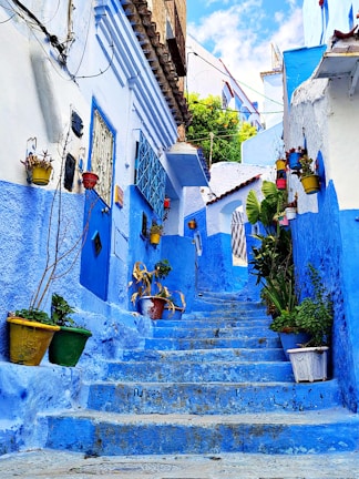 Blue alleyway with steps in a moroccan town.