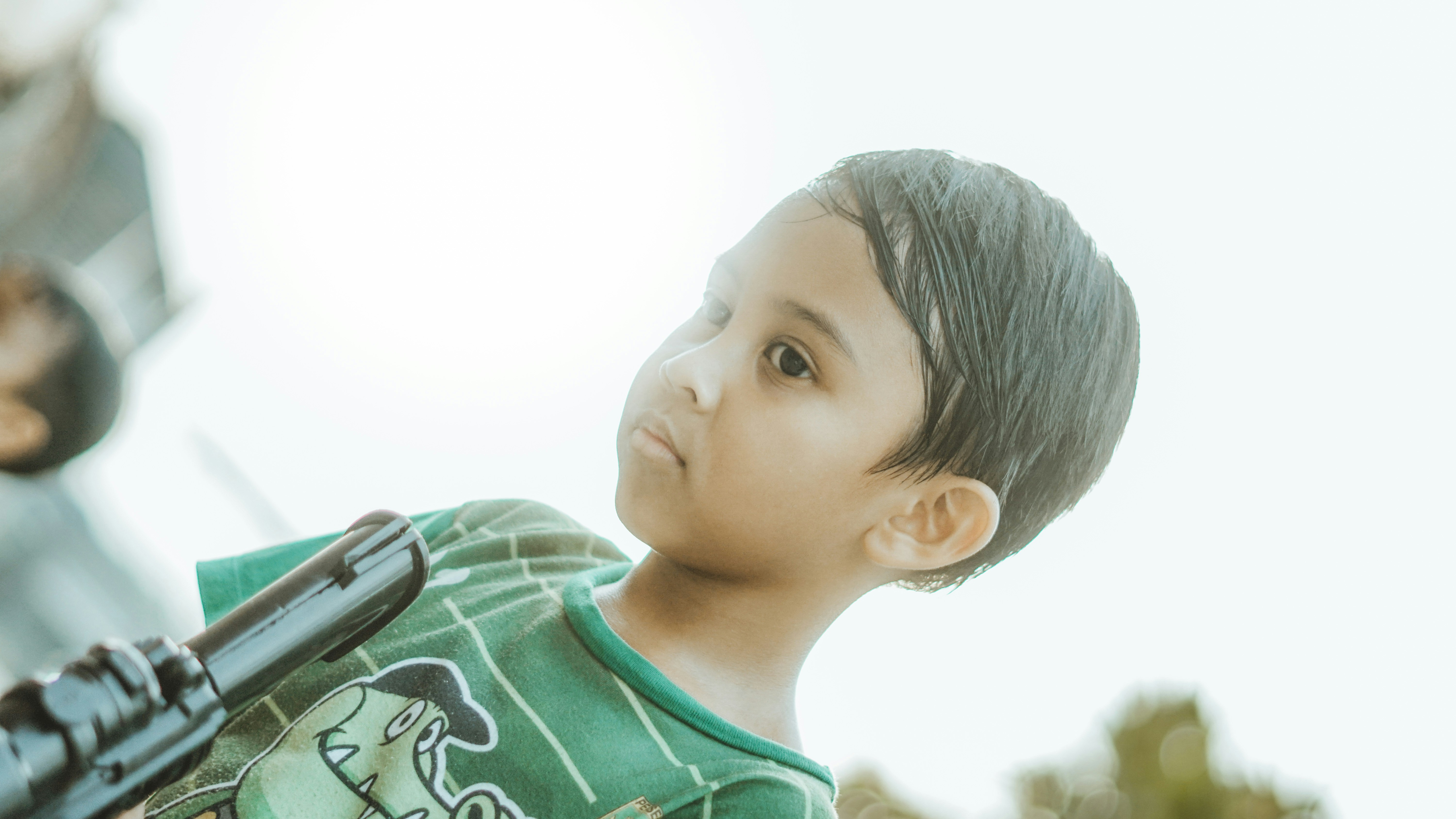 A little boy looks towards the light.