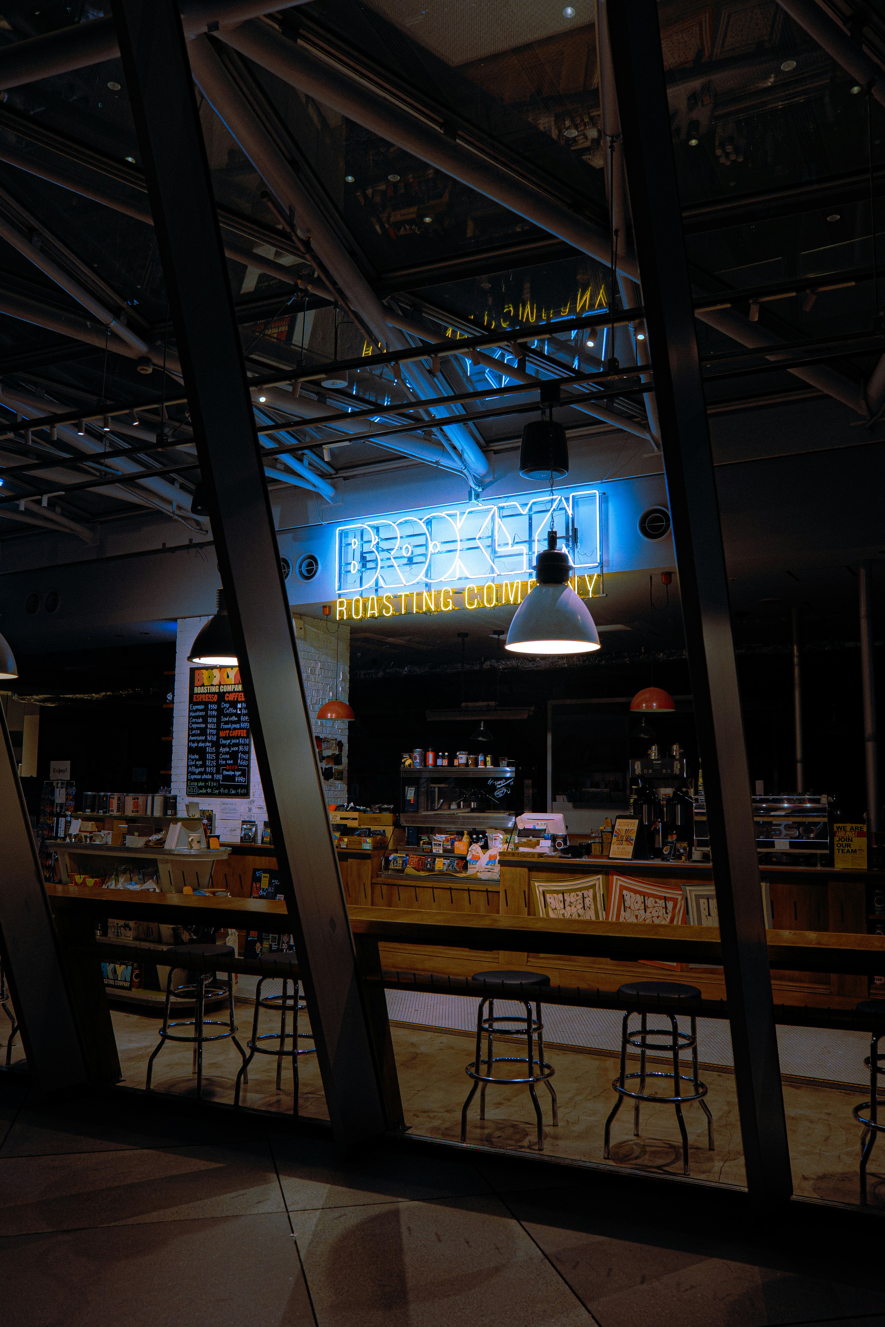 A coffee shop lights up inside the structure.