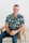 Smiling man sits in a chair