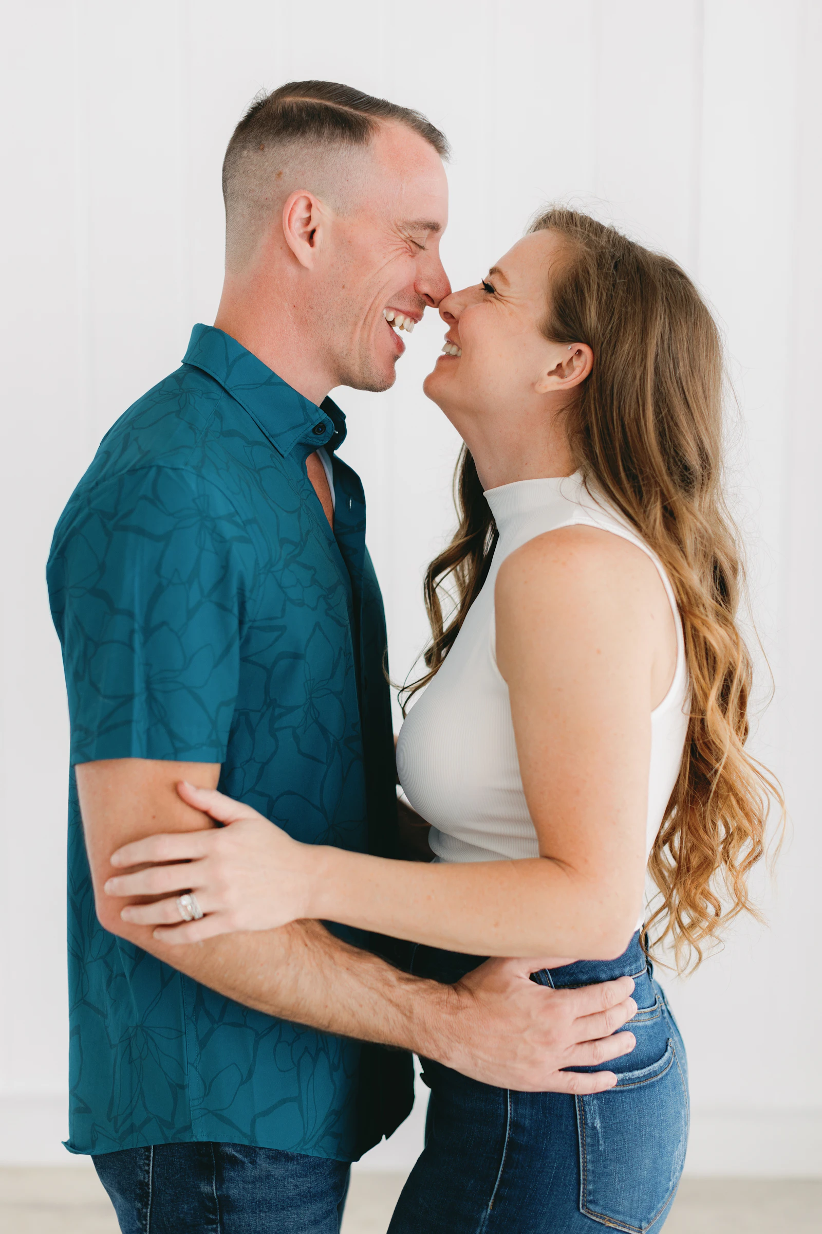 Happy couple laughing together, close to each other