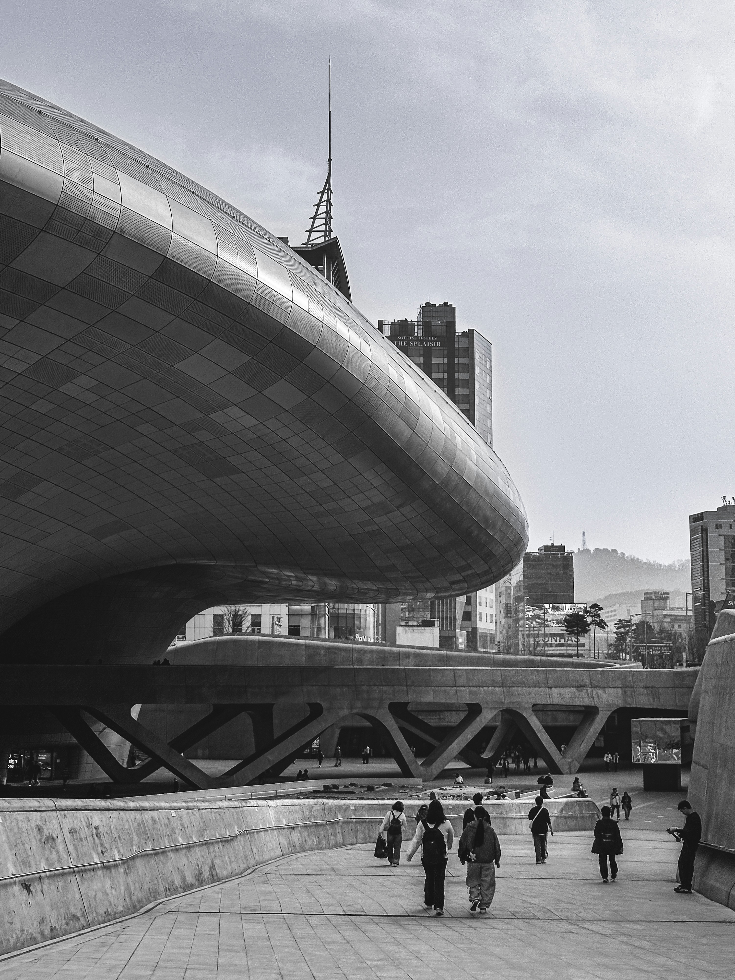 Modern architecture with people walking in the foreground.