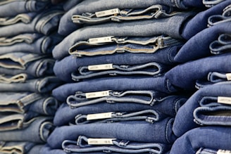 A stack of neatly folded blue jeans.