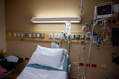 An empty hospital bed awaits a patient.
