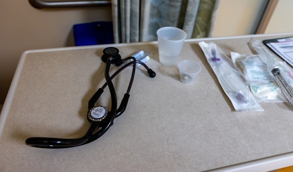 Medical tools lie on a hospital table.
