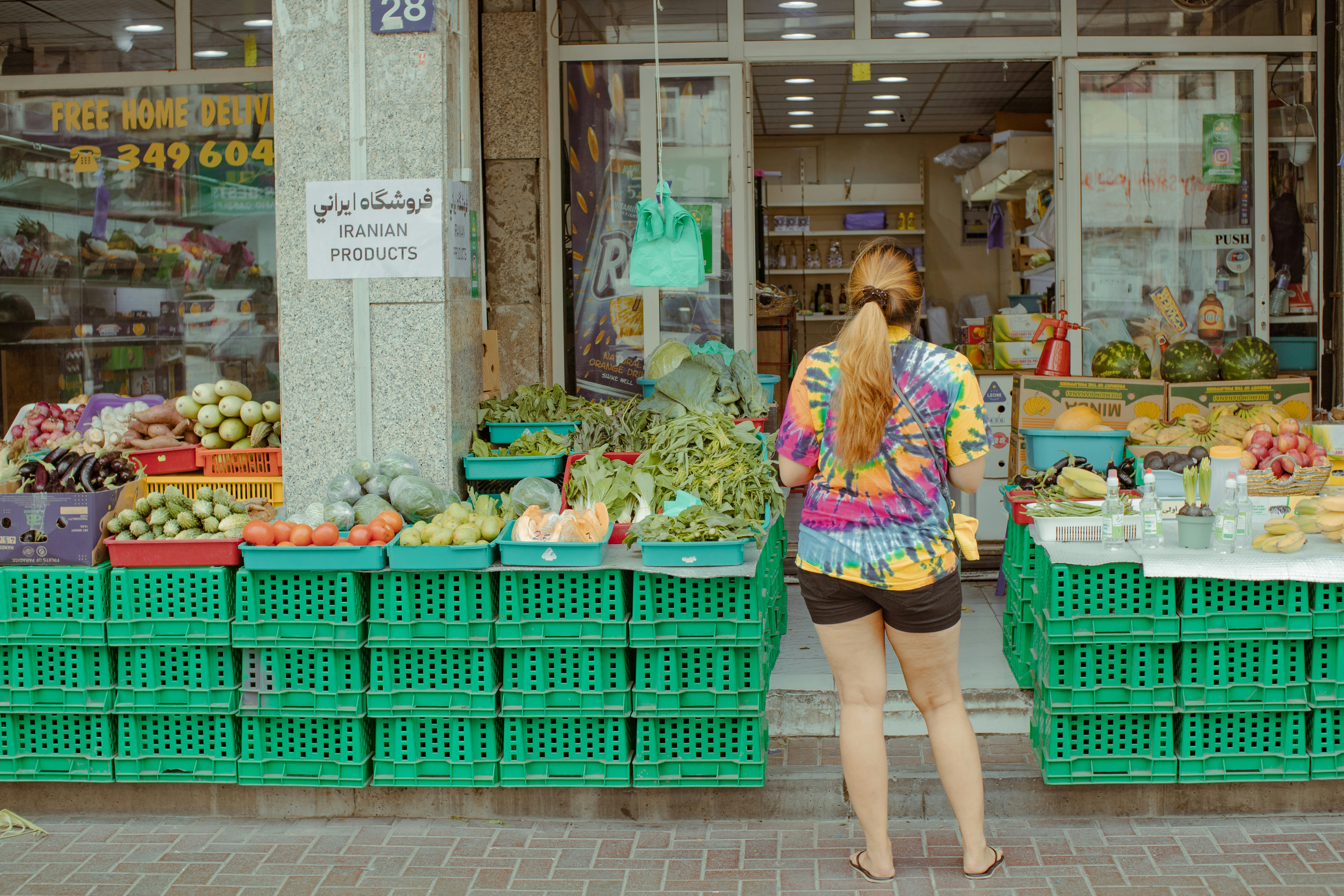 Woman shopping at a local fruit and vegetable shop.