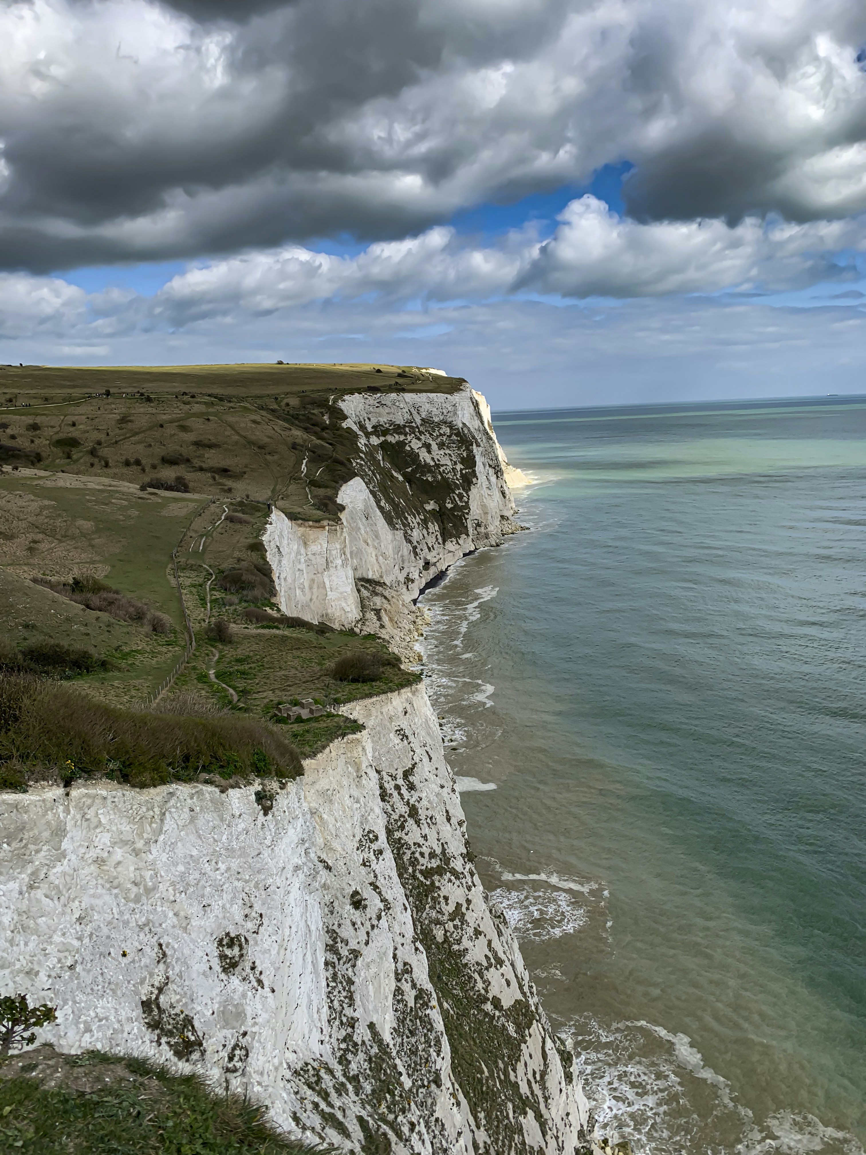 The white cliffs of dover meet the sea.