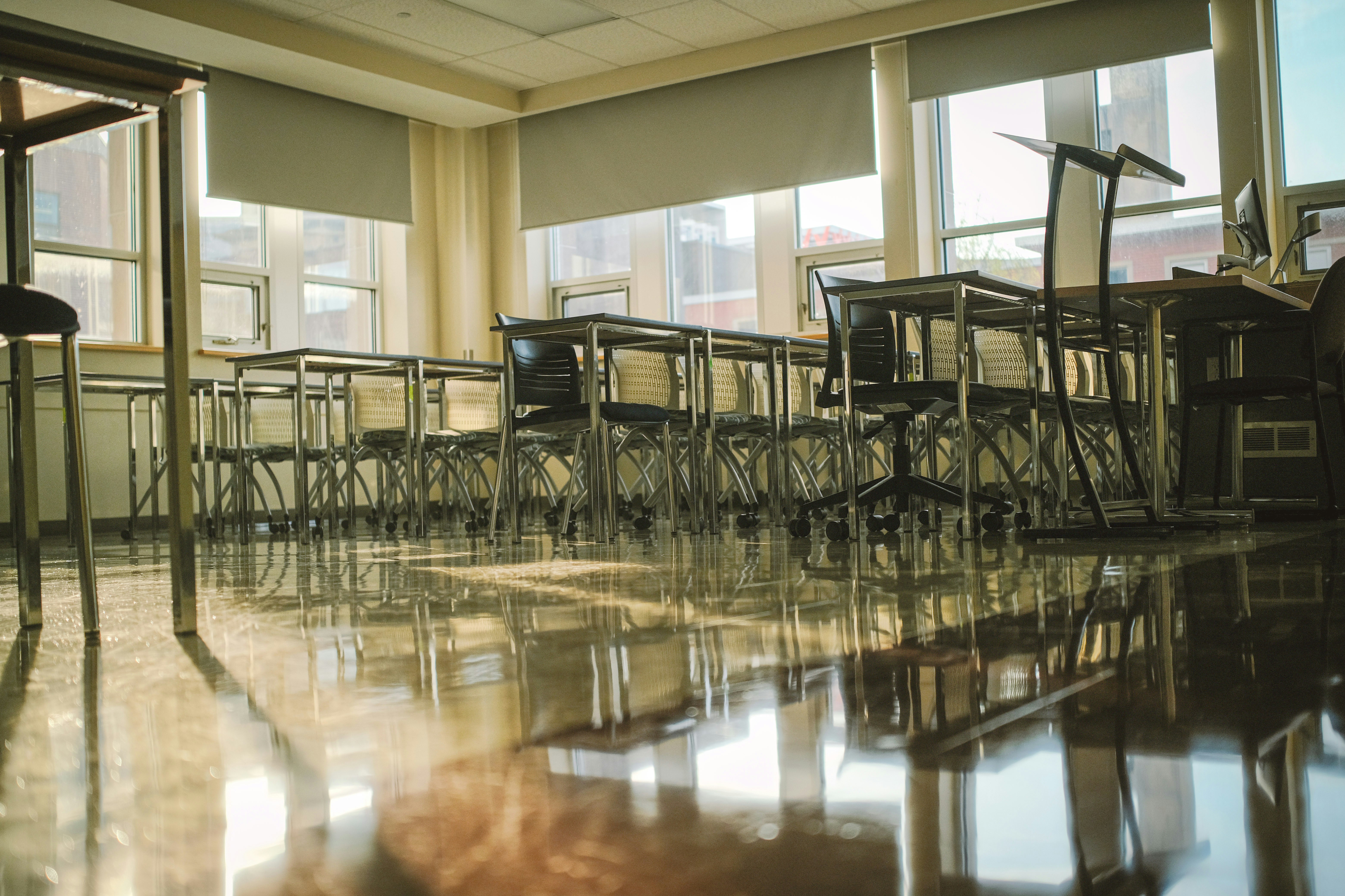 Empty classroom with tables and chairs