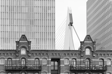 Buildings and bridge are seen against a cloudy sky