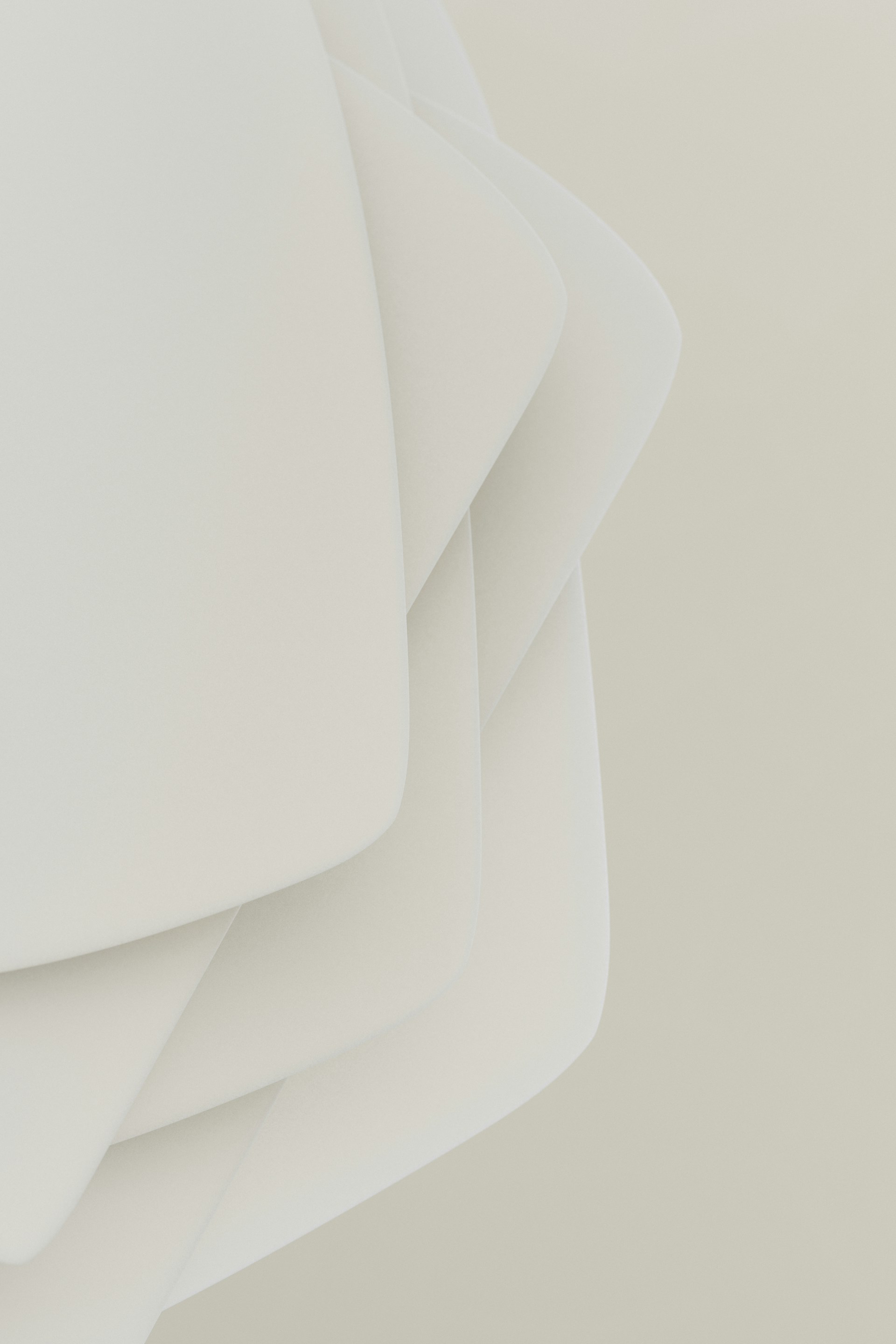 Abstract shapes layered in white.