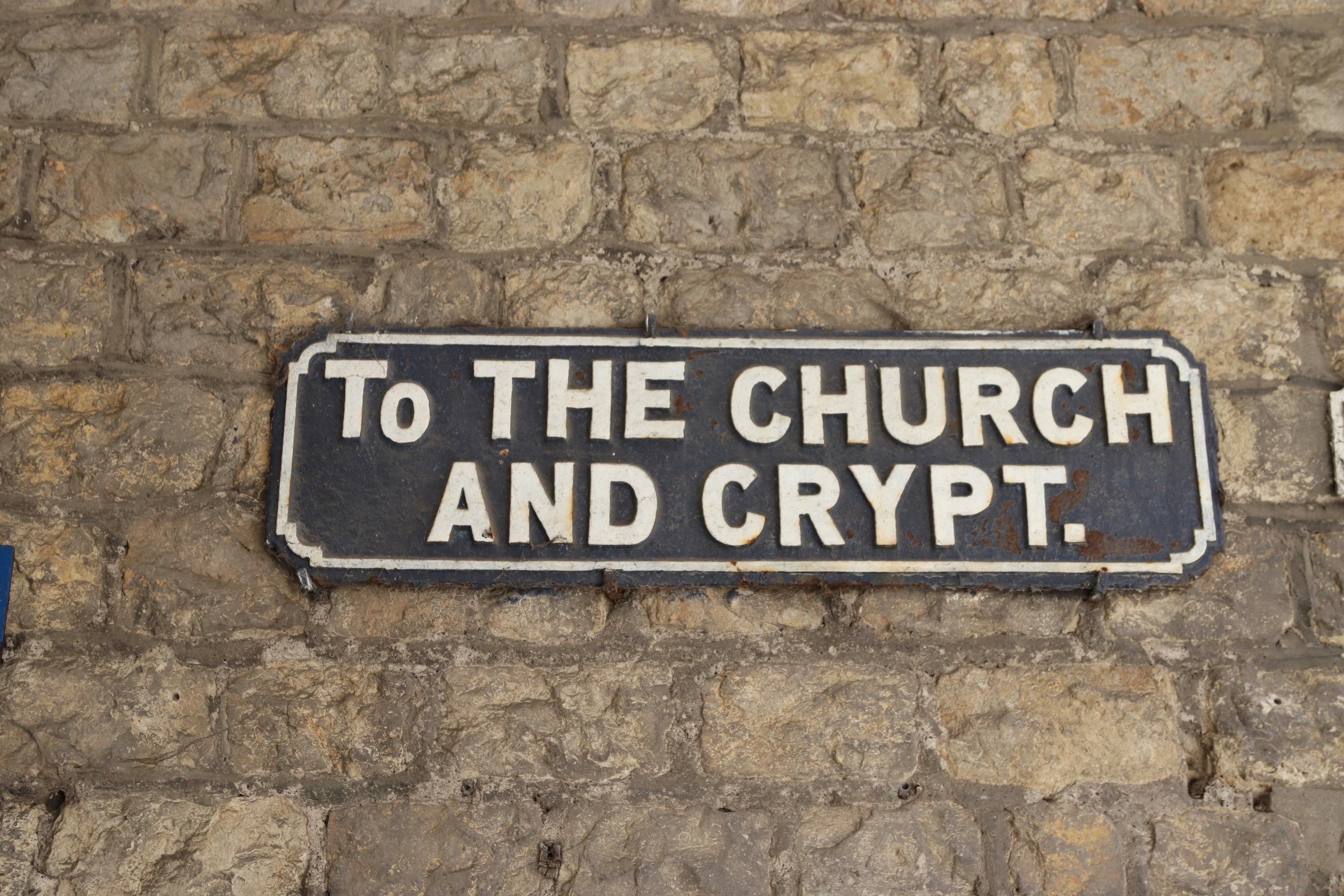 Sign directs to church and crypt