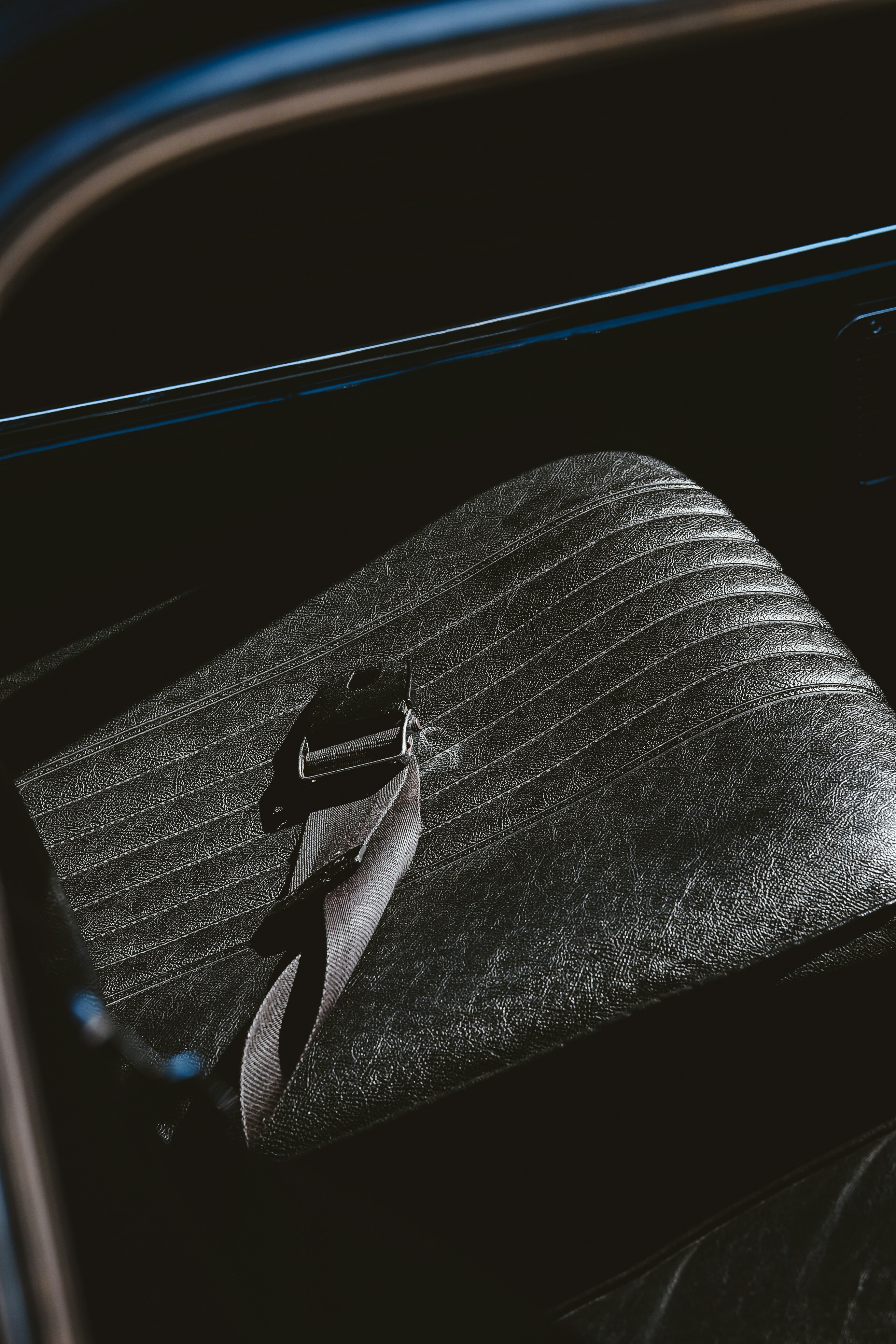 A car seat and seatbelt are shown.